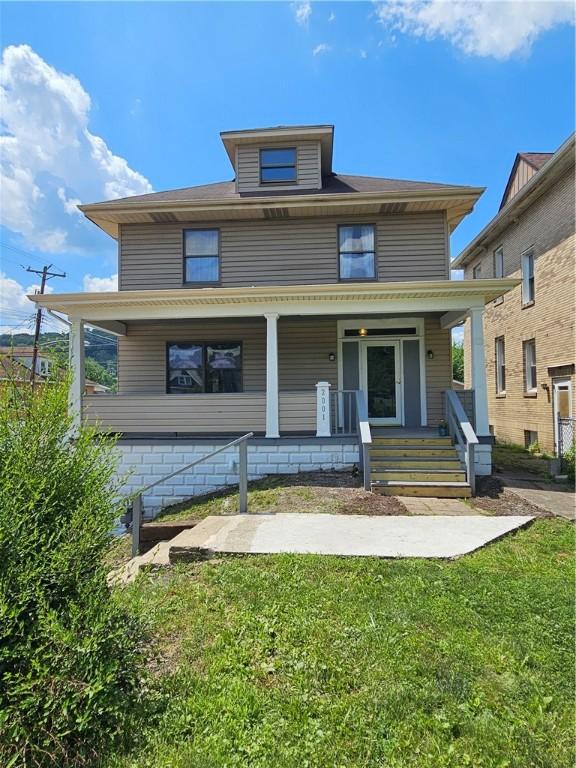 2001 7th Ave, Beaver Falls, PA 15010 - traditional style home featuring a porch and a front lawn