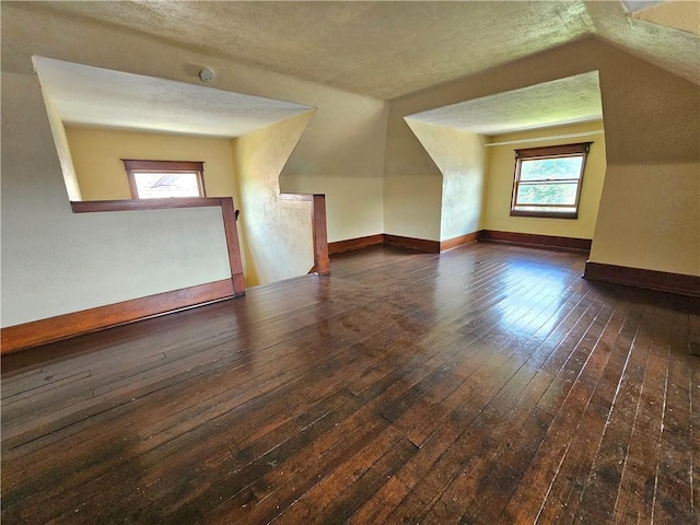 2001 7th Ave, Beaver Falls, PA 15010 - additional living space with wood-type flooring, vaulted ceiling, and a textured ceiling