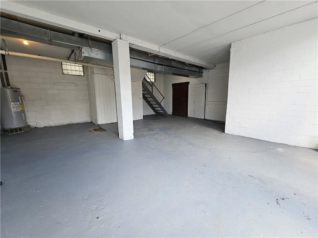 2001 7th Ave, Beaver Falls, PA 15010 - basement featuring water heater, stairs, and concrete block wall