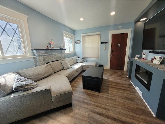1727 Tyler St, Aliquippa, PA 15001 - living room featuring a brick fireplace, wood finished floors, and recessed lighting