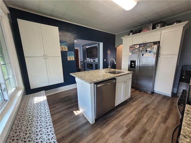 1727 Tyler St, Aliquippa, PA 15001 - kitchen featuring appliances with stainless steel finishes, dark wood-style floors, white cabinets, a kitchen island with sink, and crown molding