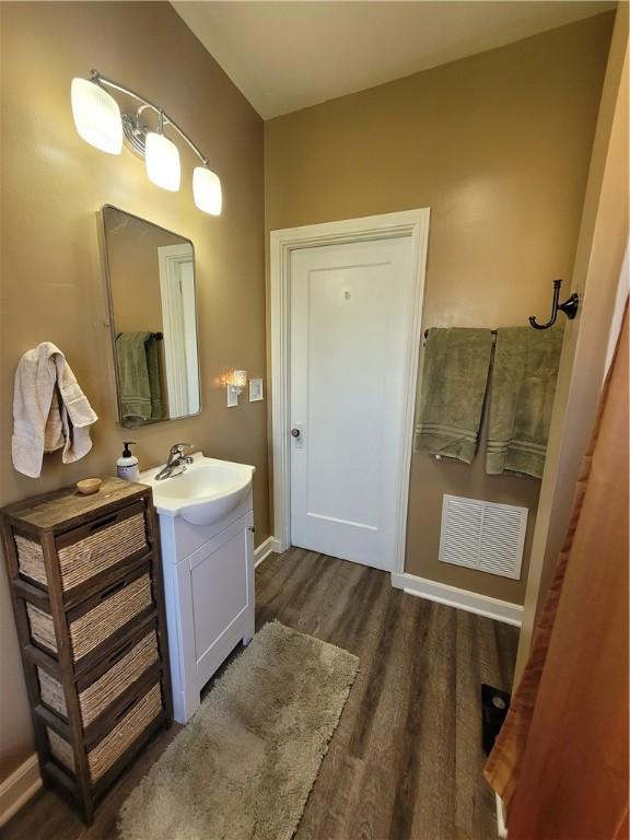 1727 Tyler St, Aliquippa, PA 15001 - bathroom with vanity and wood finished floors