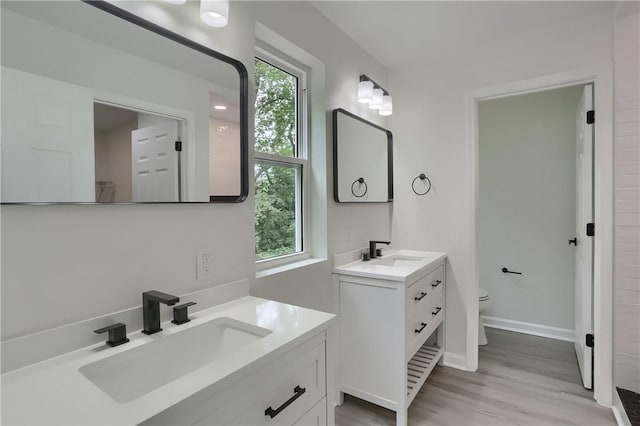 130 Center Ave, Burgettstown Boro, PA 15021 - full bathroom featuring two vanities and wood finished floors