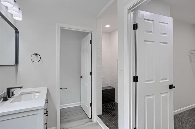130 Center Ave, Burgettstown Boro, PA 15021 - full bathroom with vanity, a tile shower, recessed lighting, and wood finished floors
