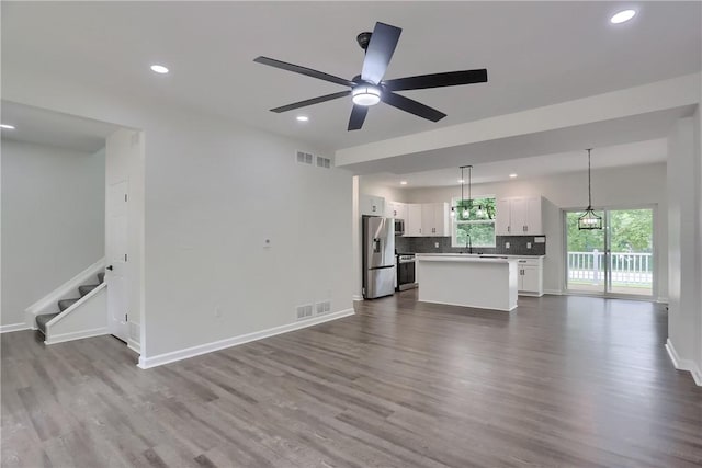 130 Center Ave, Burgettstown Boro, PA 15021 - unfurnished living room with a ceiling fan, recessed lighting, dark wood-style flooring, and stairway