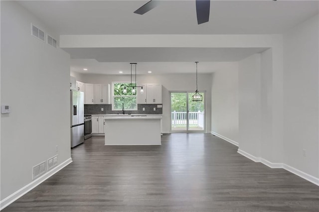 130 Center Ave, Burgettstown Boro, PA 15021 - kitchen featuring stainless steel appliances, dark wood-style floors, backsplash, white cabinetry, and recessed lighting