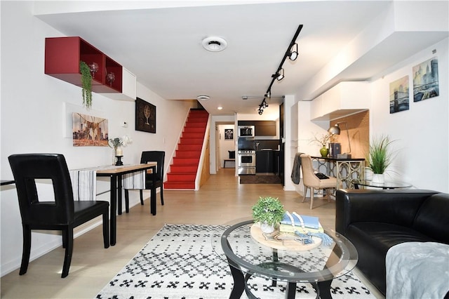 325 S Highland Ave Unit 105, Shadyside, PA 15206 - living area with rail lighting, stairs, and light wood-type flooring