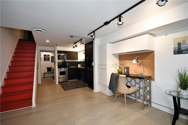 325 S Highland Ave Unit 105, Shadyside, PA 15206 - living area featuring light wood-style floors, stairway, track lighting, and recessed lighting