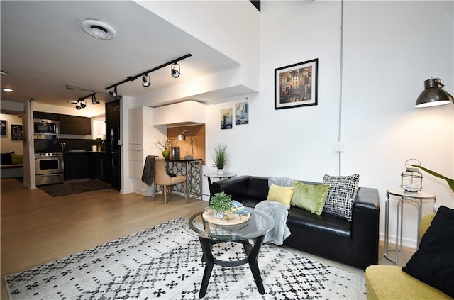 325 S Highland Ave Unit 105, Shadyside, PA 15206 - living room featuring light wood-style floors and rail lighting