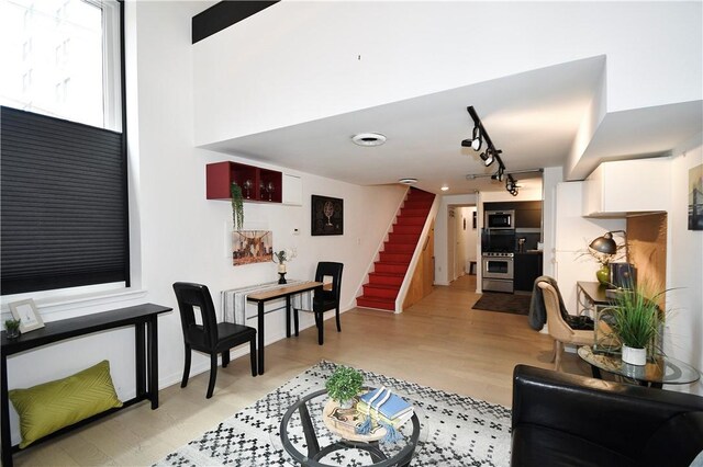 325 S Highland Ave Unit 105, Shadyside, PA 15206 - living area featuring stairway, rail lighting, and light wood-style flooring