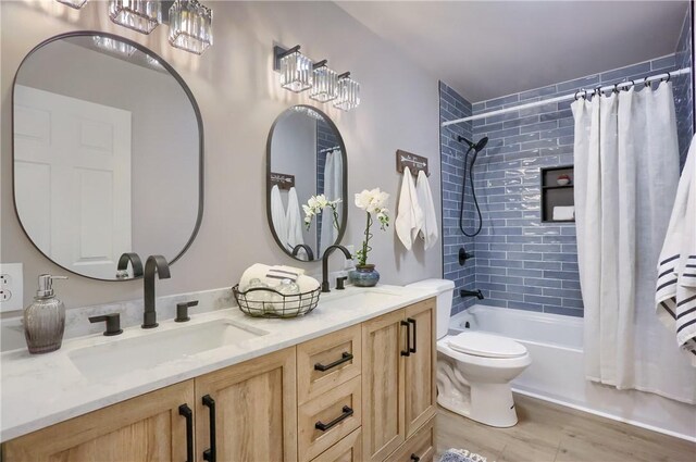 1611 18th Ave, Patterson Heights, PA 15010 - full bathroom with double vanity, shower / tub combo, and wood finished floors