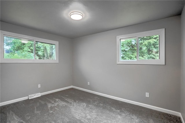 1611 18th Ave, Patterson Heights, PA 15010 - spare room with plenty of natural light and dark colored carpet