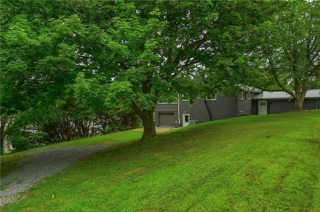 1611 18th Ave, Patterson Heights, PA 15010 - view of green lawn with driveway and an attached garage