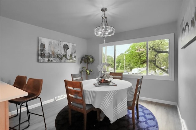 1611 18th Ave, Patterson Heights, PA 15010 - dining room featuring wood finished floors and a chandelier