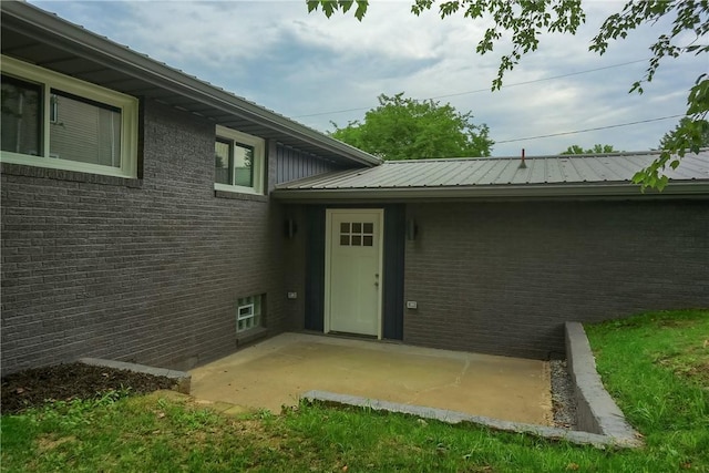 1611 18th Ave, Patterson Heights, PA 15010 - entrance to property featuring a patio area, brick siding, and a metal roof