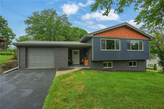 1611 18th Ave, Patterson Heights, PA 15010 - tri-level home with a garage, asphalt driveway, a front yard, brick siding, and a metal roof