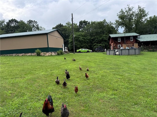233 Grantz Hollow Rd, Bethel Twp, PA 15690 - view of green lawn with an outdoor pool and a pole building