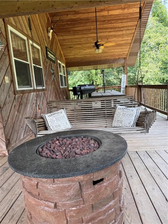 233 Grantz Hollow Rd, Bethel Twp, PA 15690 - wooden deck featuring an outdoor fire pit, a ceiling fan, and a grill