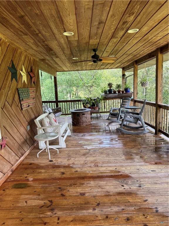 233 Grantz Hollow Rd, Bethel Twp, PA 15690 - deck with an outdoor fire pit and a ceiling fan