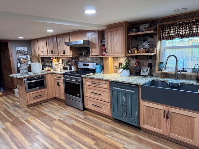 233 Grantz Hollow Rd, Bethel Twp, PA 15690 - kitchen featuring stainless steel appliances, a peninsula, decorative backsplash, light stone countertops, and recessed lighting