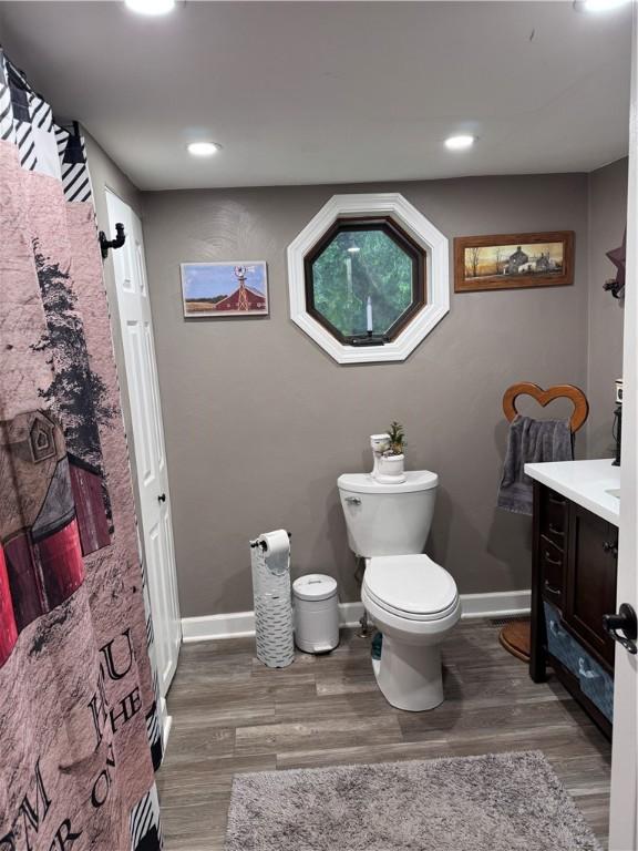 233 Grantz Hollow Rd, Bethel Twp, PA 15690 - full bathroom with vanity, wood finished floors, and recessed lighting