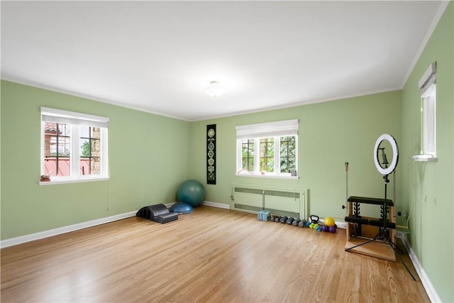60 Longuevue Dr, Mt Lebanon, PA 15228 - workout area featuring radiator heating unit, healthy amount of natural light, wood finished floors, and ornamental molding