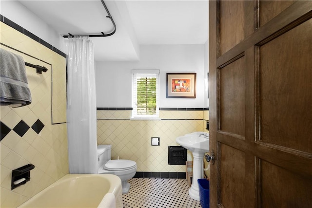 60 Longuevue Dr, Mt Lebanon, PA 15228 - bathroom featuring wainscoting, tile walls, and shower / bath combo
