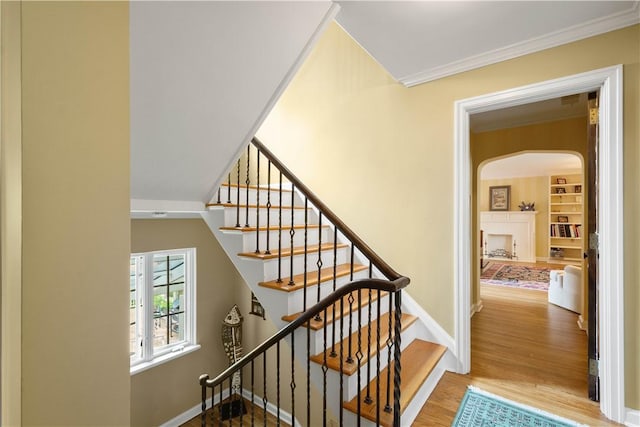 60 Longuevue Dr, Mt Lebanon, PA 15228 - staircase with crown molding, arched walkways, and wood finished floors