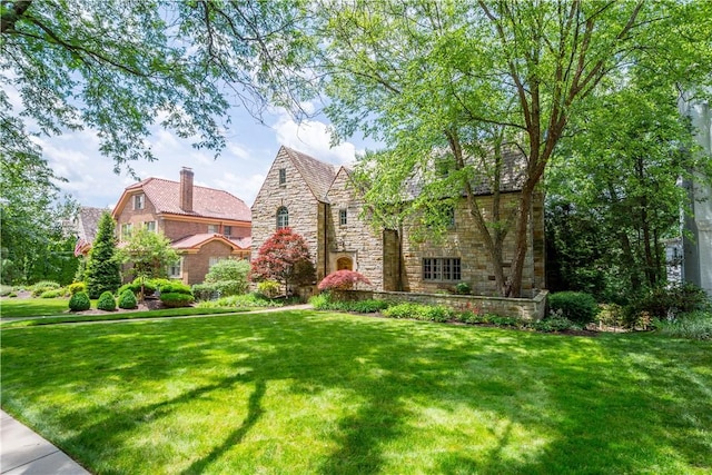 60 Longuevue Dr, Mt Lebanon, PA 15228 - english style home with stone siding, a front yard, and a chimney