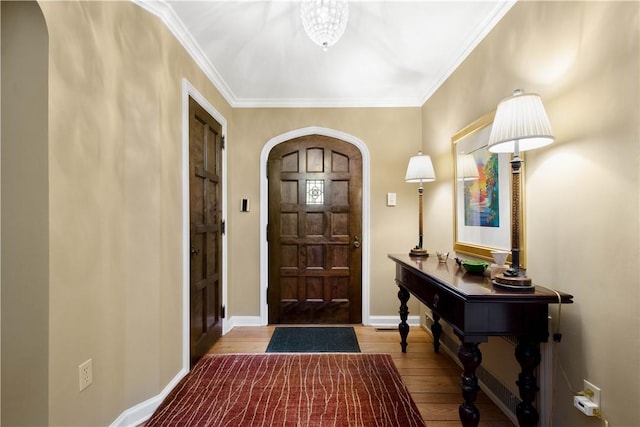 60 Longuevue Dr, Mt Lebanon, PA 15228 - entryway with arched walkways, wood finished floors, and ornamental molding
