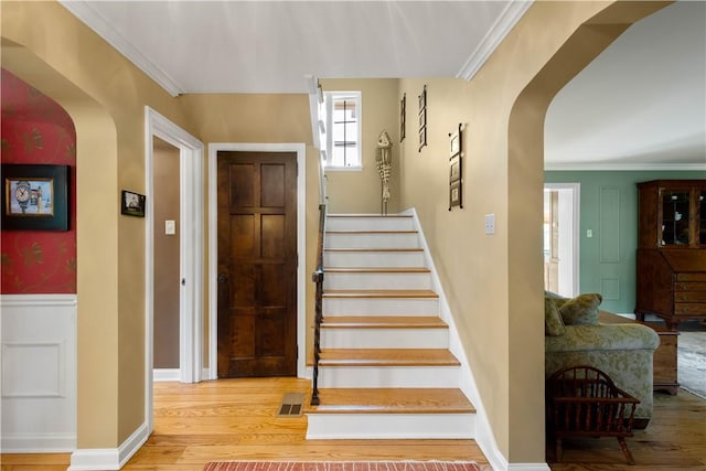 60 Longuevue Dr, Mt Lebanon, PA 15228 - stairs with arched walkways, wood finished floors, and ornamental molding