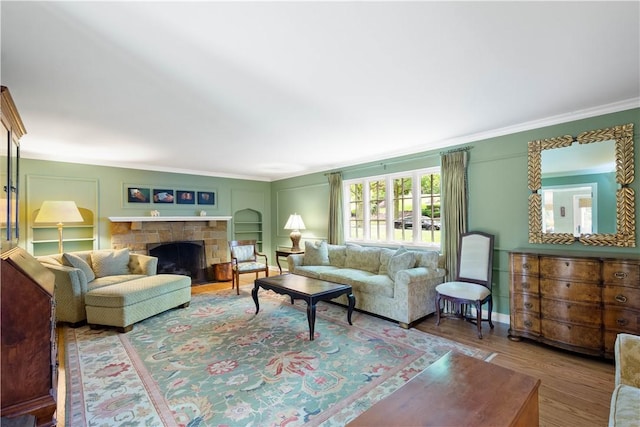 60 Longuevue Dr, Mt Lebanon, PA 15228 - living area with ornamental molding, wood finished floors, and a stone fireplace