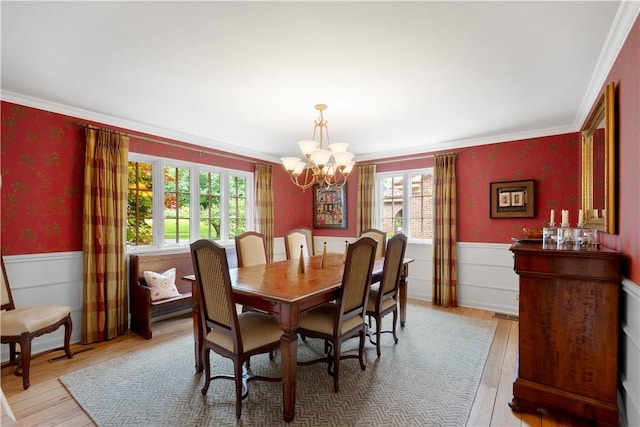60 Longuevue Dr, Mt Lebanon, PA 15228 - dining space with a wainscoted wall, a chandelier, wood finished floors, crown molding, and wallpapered walls