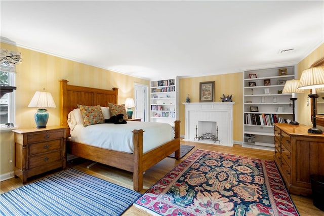 60 Longuevue Dr, Mt Lebanon, PA 15228 - bedroom featuring ornamental molding, wood finished floors, and a fireplace