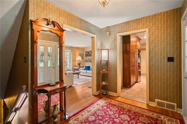1026 Cambridge St, Harrison Twp, PA 15065 - entrance foyer featuring wallpapered walls and light wood-style flooring