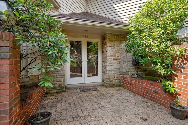 1026 Cambridge St, Harrison Twp, PA 15065 - doorway to property featuring french doors, stone siding, and a patio