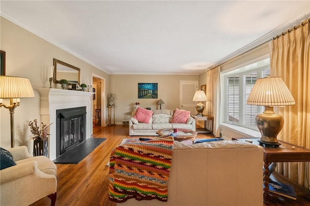 1026 Cambridge St, Harrison Twp, PA 15065 - living area with wood finished floors, ornamental molding, and a fireplace with raised hearth