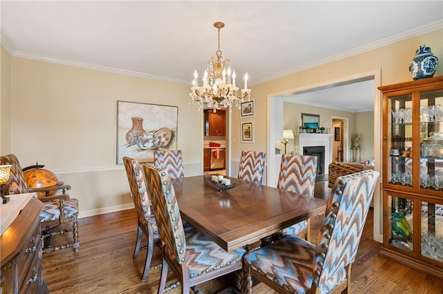 1026 Cambridge St, Harrison Twp, PA 15065 - dining room with wood finished floors, a chandelier, crown molding, and a fireplace