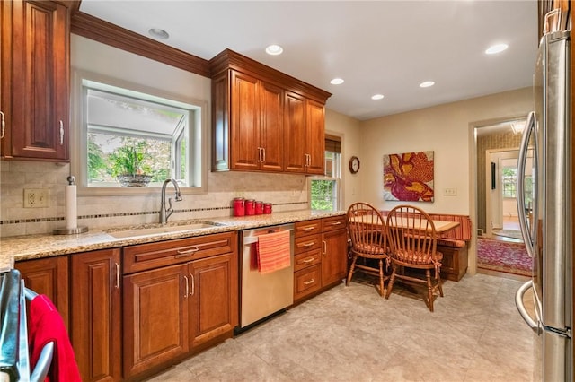 1026 Cambridge St, Harrison Twp, PA 15065 - kitchen with appliances with stainless steel finishes, plenty of natural light, recessed lighting, and brown cabinetry