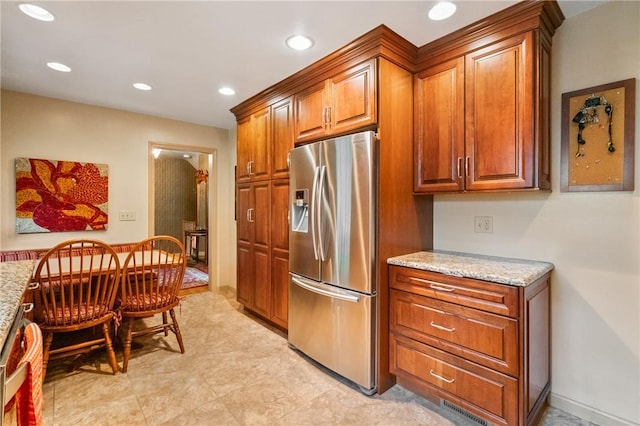 1026 Cambridge St, Harrison Twp, PA 15065 - kitchen featuring stainless steel fridge with ice dispenser, brown cabinets, light stone counters, and recessed lighting