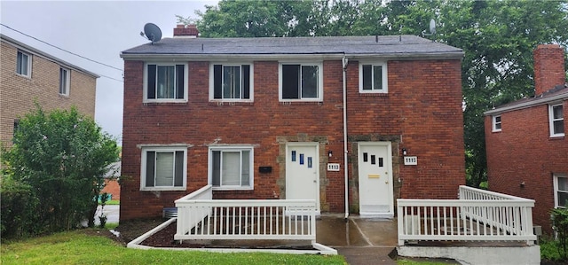 1113-1115 Woodbine, Stanton Heights, PA 15201 - view of front facade with brick siding and a chimney