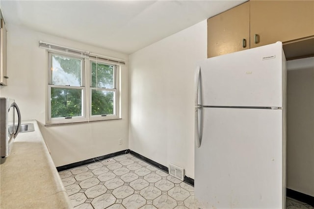 1113-1115 Woodbine, Stanton Heights, PA 15201 - kitchen featuring freestanding refrigerator, light flooring, and light countertops