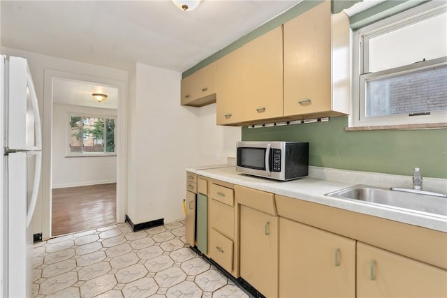 1113-1115 Woodbine, Stanton Heights, PA 15201 - kitchen featuring stainless steel microwave, freestanding refrigerator, light countertops, and light flooring