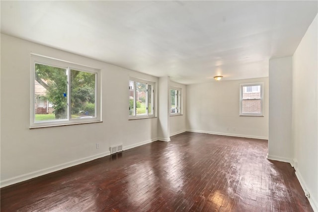 1113-1115 Woodbine, Stanton Heights, PA 15201 - empty room with healthy amount of natural light and dark wood finished floors