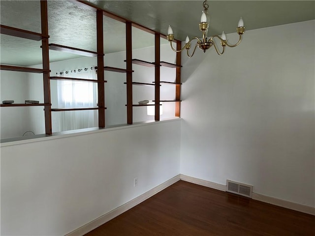 157 Elizabeth St, South Union Twp, PA 15445 - empty room featuring a chandelier and wood finished floors