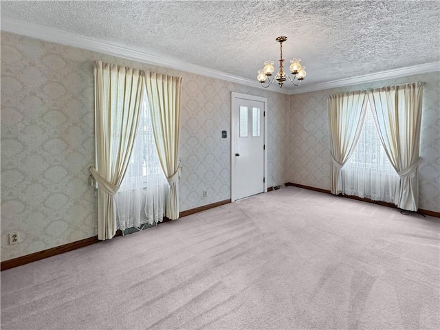 979 9th St, Taylor Twp, PA 16160 - carpeted empty room featuring a chandelier, ornamental molding, and a textured ceiling
