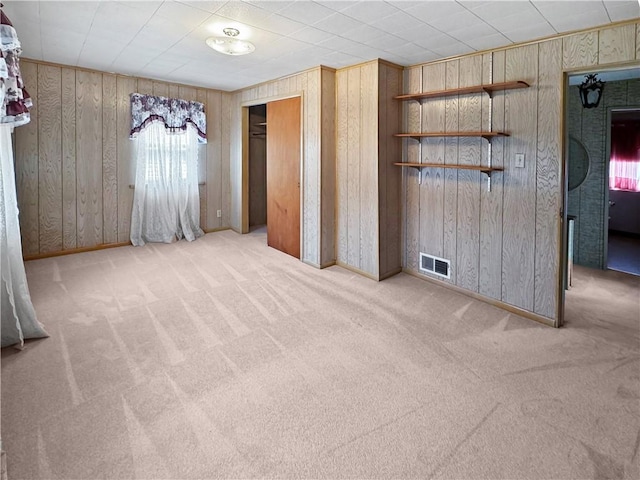 979 9th St, Taylor Twp, PA 16160 - unfurnished bedroom featuring wood walls and carpet flooring
