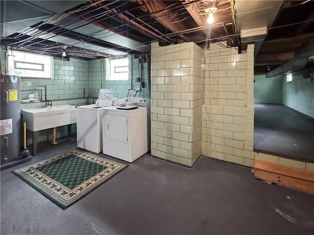 979 9th St, Taylor Twp, PA 16160 - below grade area with electric water heater, washer and clothes dryer, and plenty of natural light