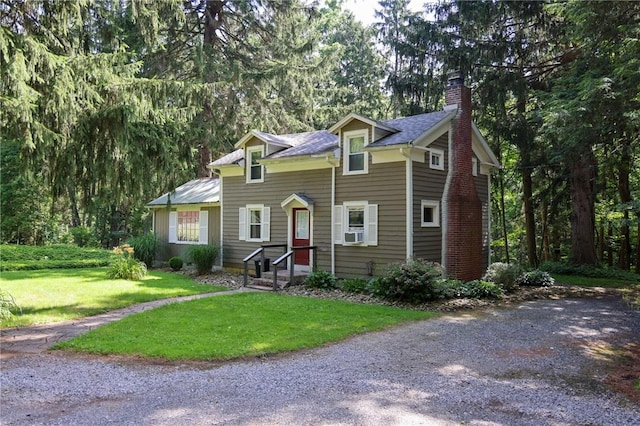 1638 Lake Rd, Pa, PA 16137 - view of front of home featuring a chimney, a front yard, and view of wooded area