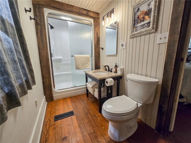1638 Lake Rd, Pa, PA 16137 - bathroom with wood-type flooring, a shower stall, vanity, and wooden walls